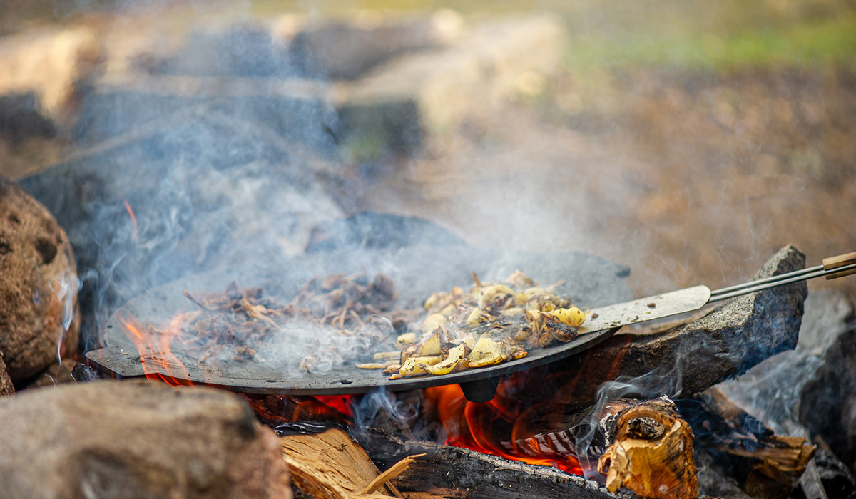 Outdoor cooking over open fire in southeast Sweden